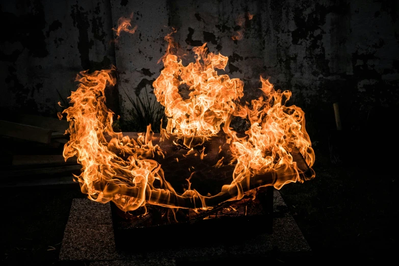 an image of flames coming from a square grill