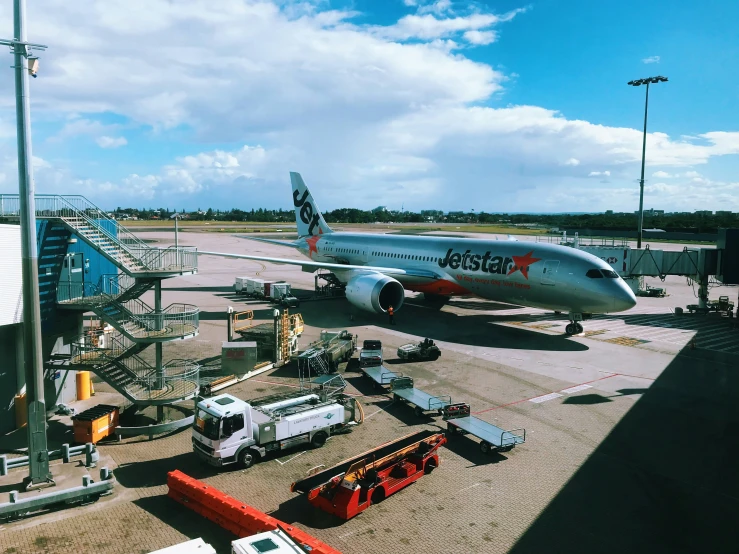 an airplane being serviced on a runway