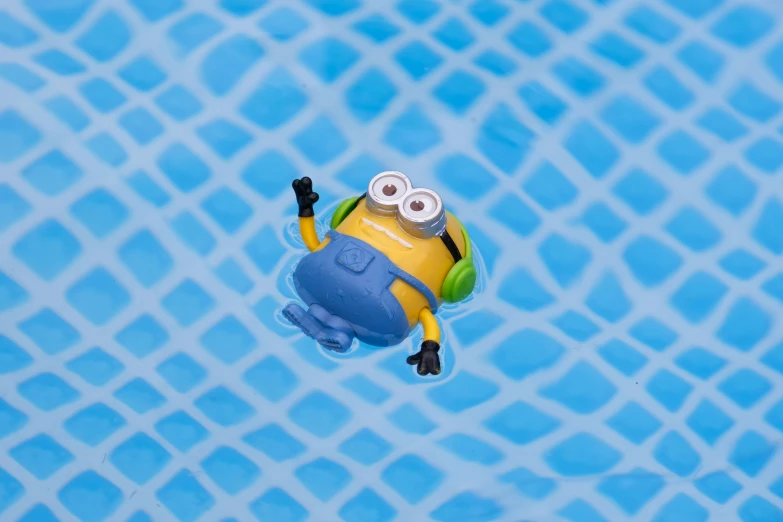 a toy toy floating in a pool filled with water