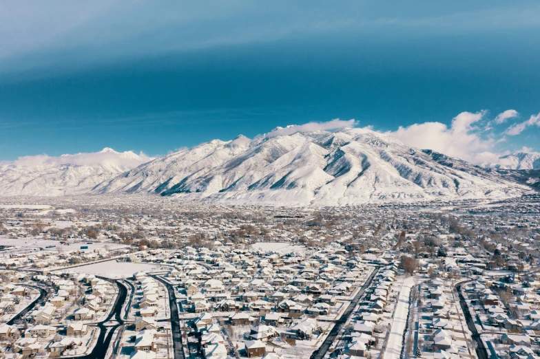 the mountains in the background are covered with snow