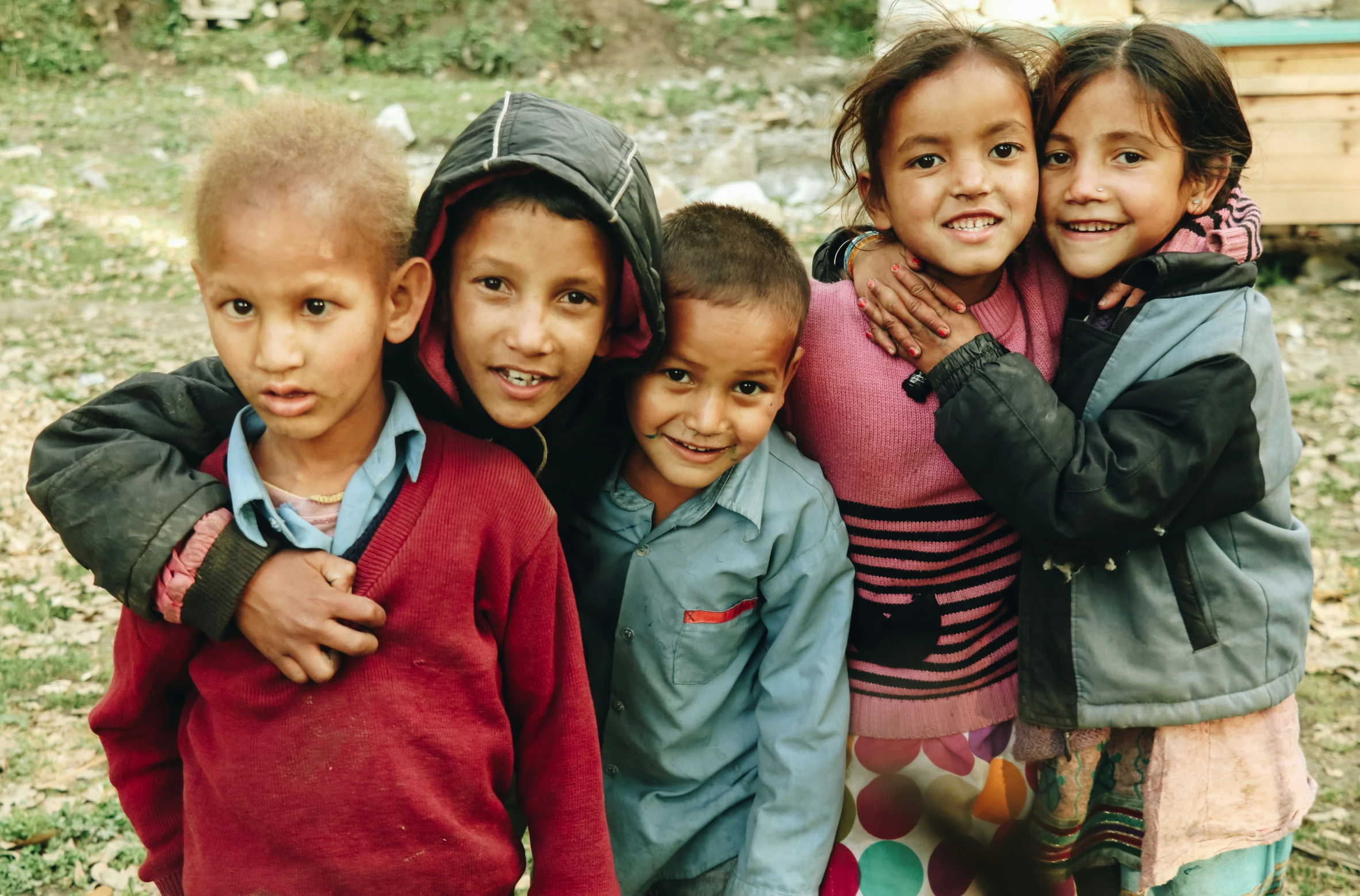 a group of children pose for a picture