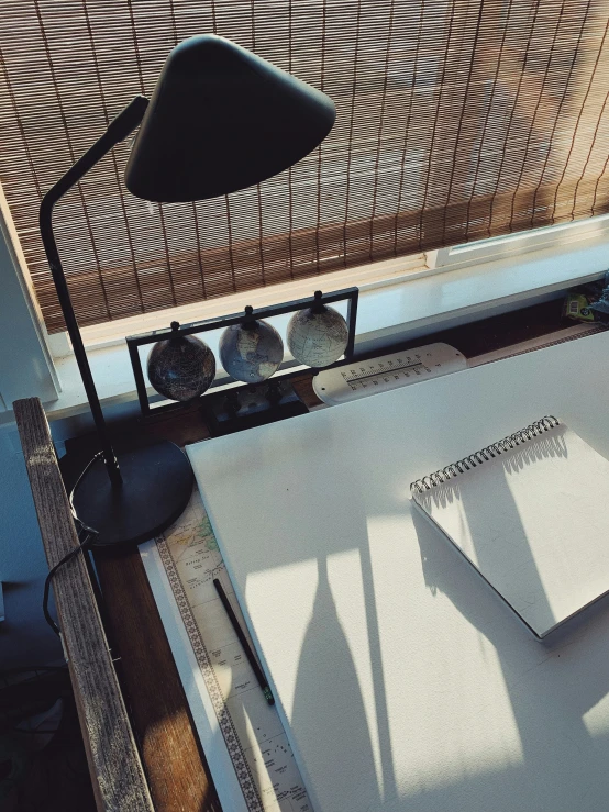 a chair, lamp and a sheet of paper with writing on it