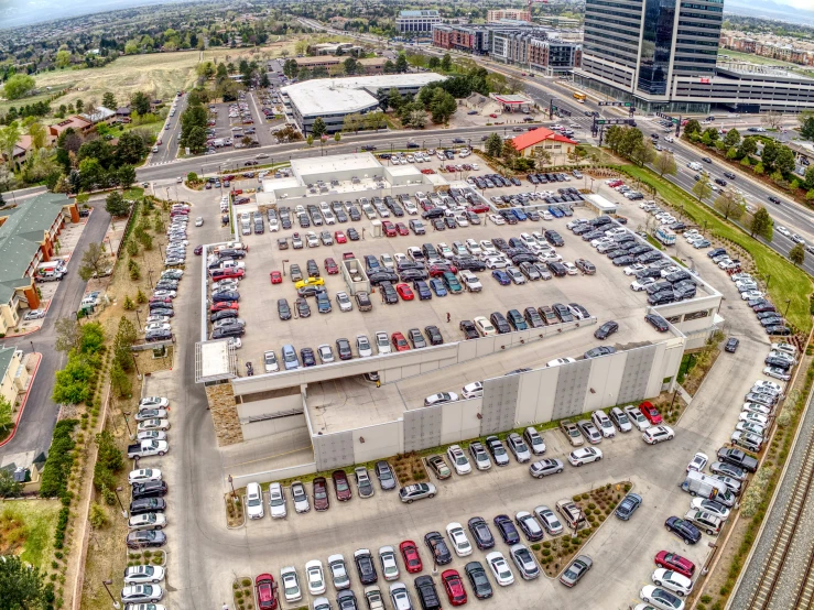 an overhead view of a parking lot with many parked cars