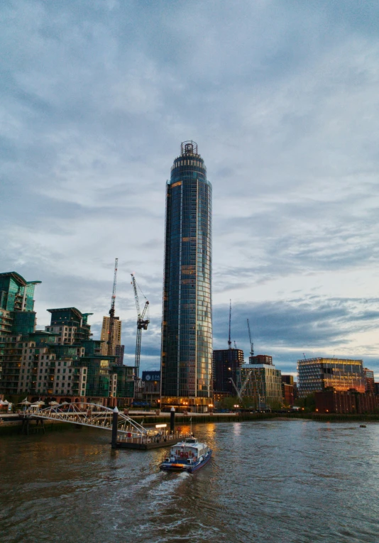 a boat is sailing in the water near tall buildings