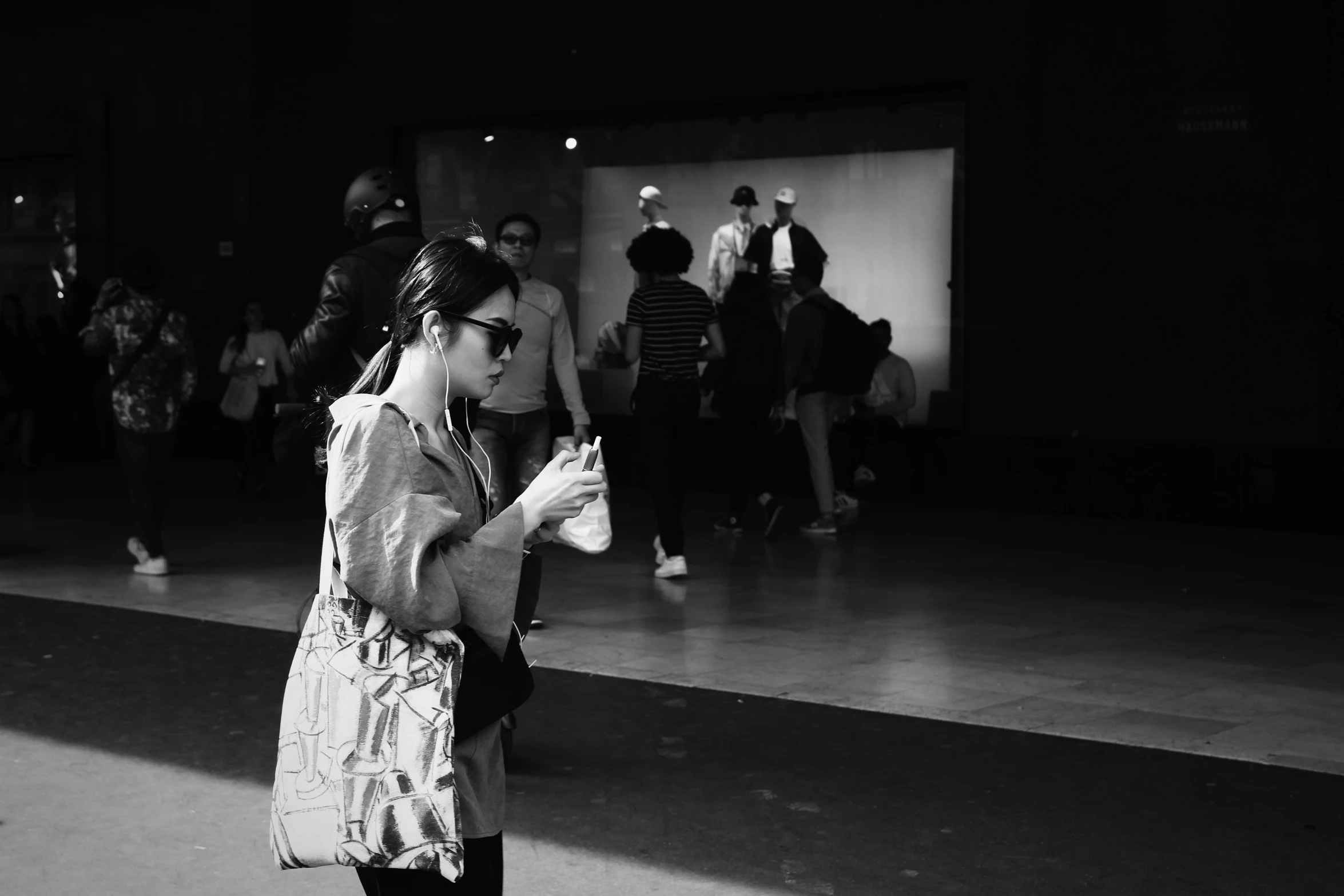 black and white po of woman in an airport waiting area