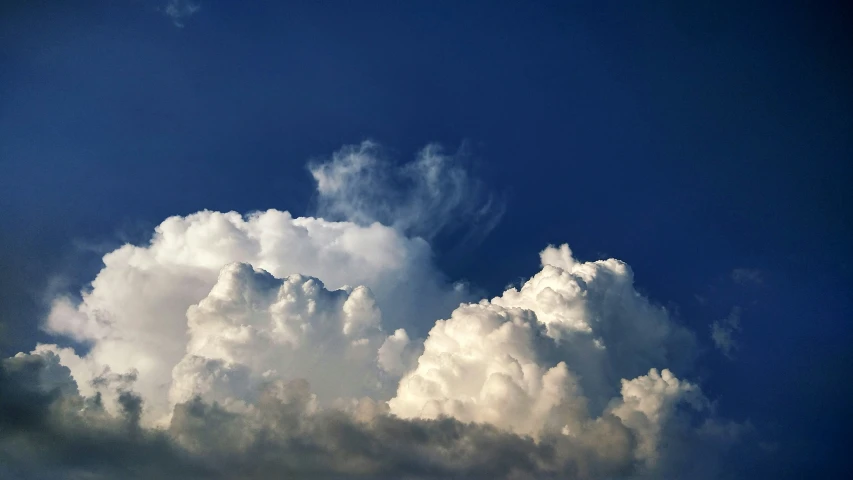 a large, fluffy cloud is seen in the sky