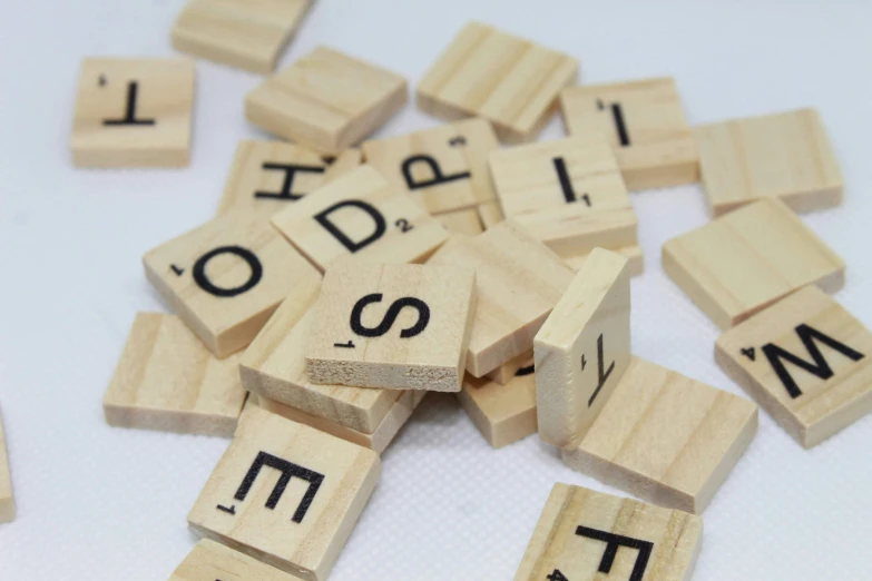 scrabbles spelled on a table with the letters to spell out soing