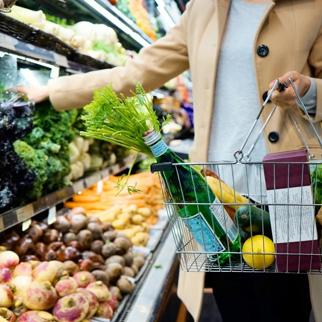 a woman is shopping in the grocery store