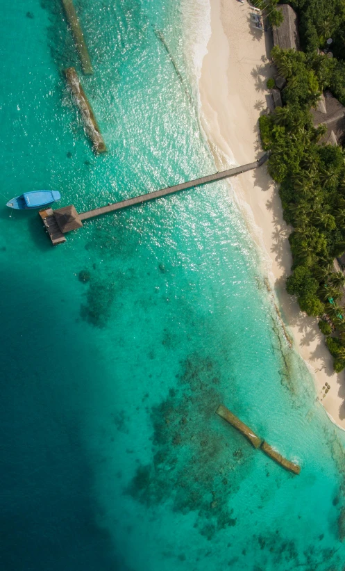 a blue body of water with wooden structures floating in it