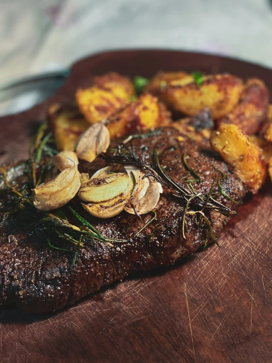 a steak on the plate has mushrooms and green sprouts