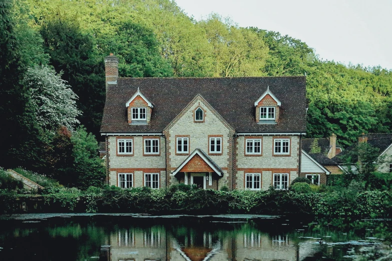 a house that is surrounded by a lot of trees