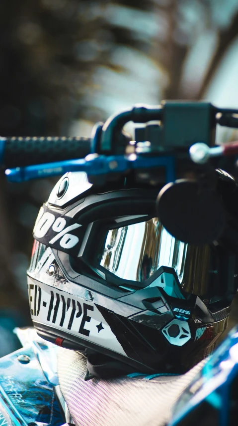 a helmet and goggles laying on top of a snowboard