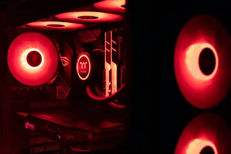 three glowing lights that are inside of a computer