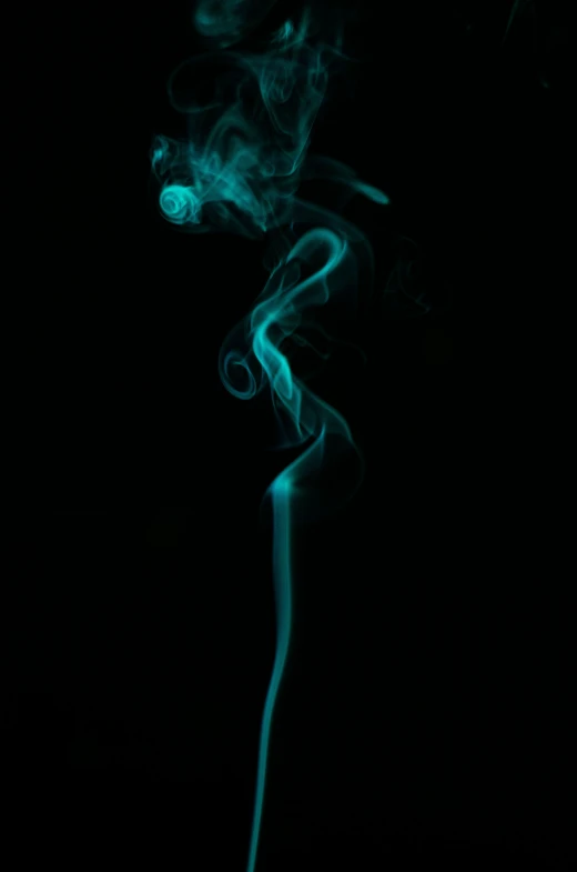 a black background, including a long cigarette with green smoke