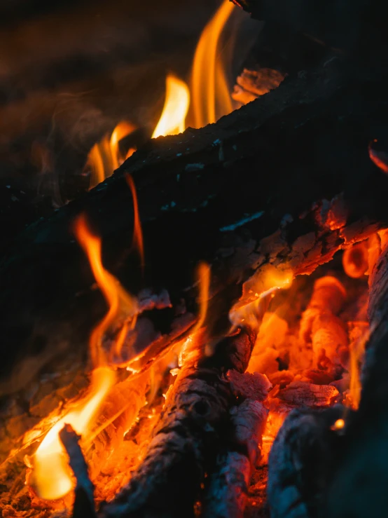 a large close up s of some wood and fire