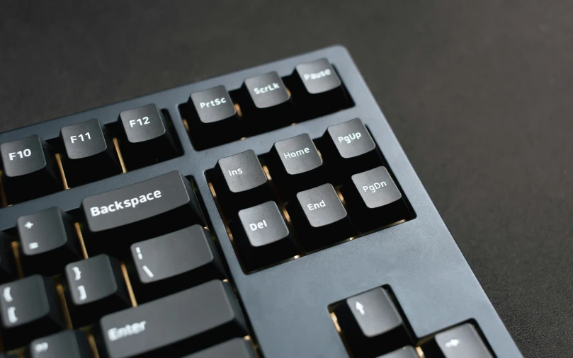 a black computer keyboard with black keys on it