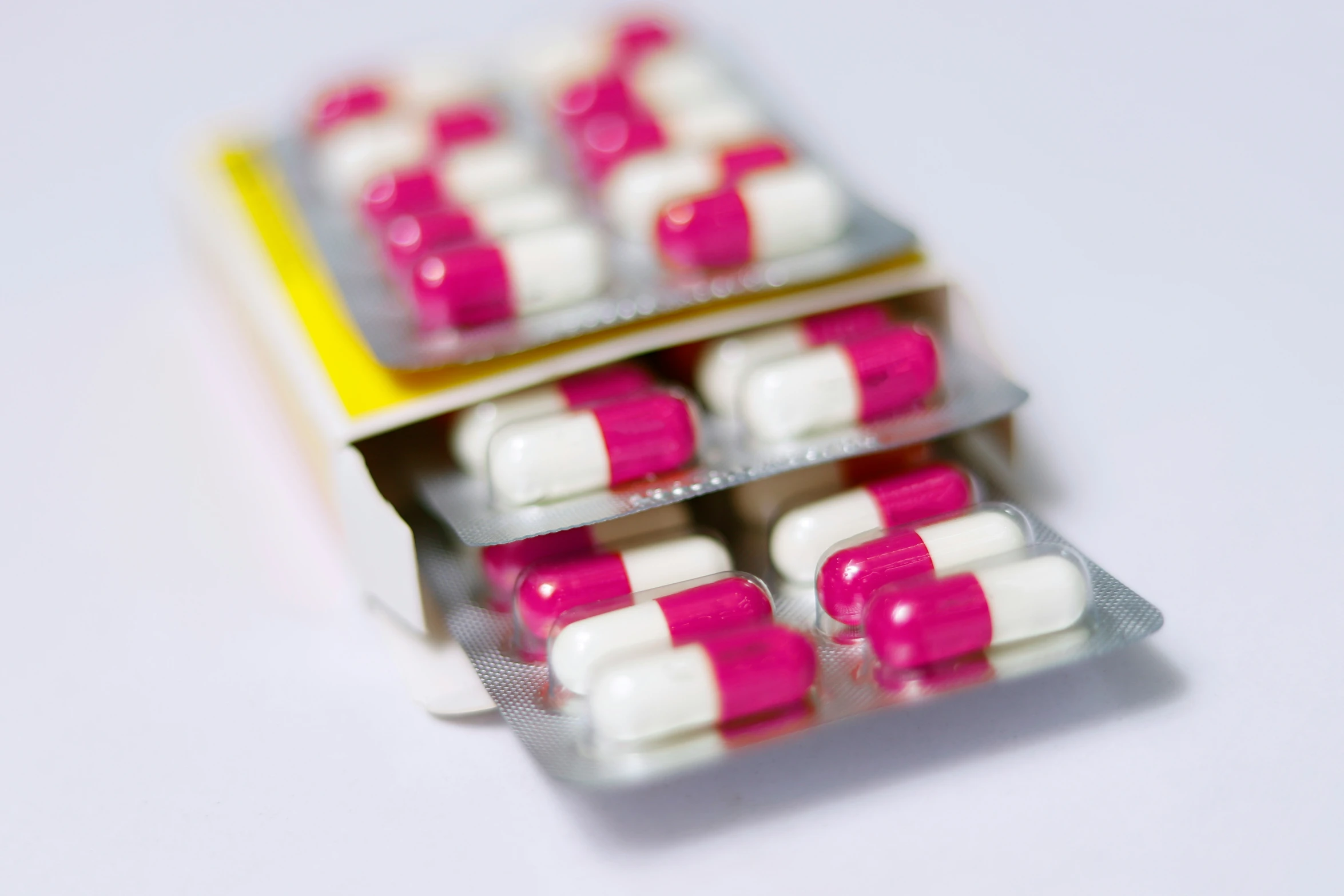 a box of pill - shaped pill cases filled with vitamin pills