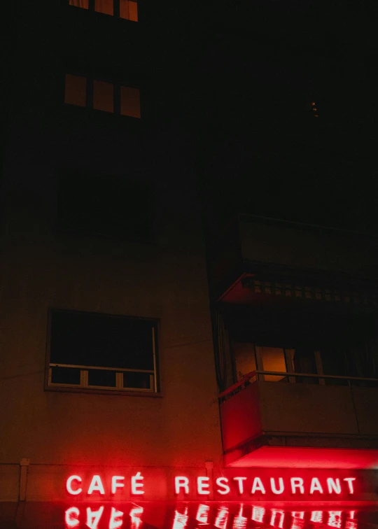 neon signs on the side of a building