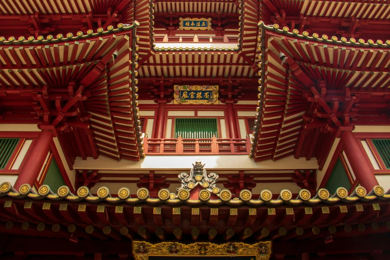 an oriental style building with lots of red and yellow decor