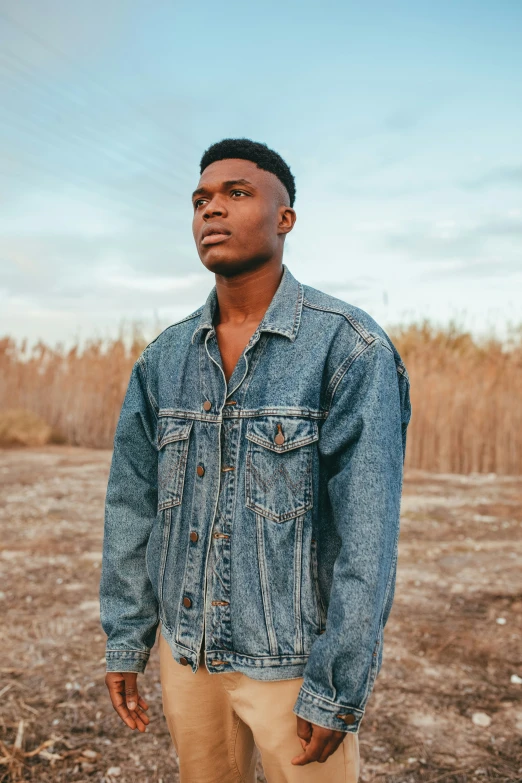 a man standing in the middle of a field