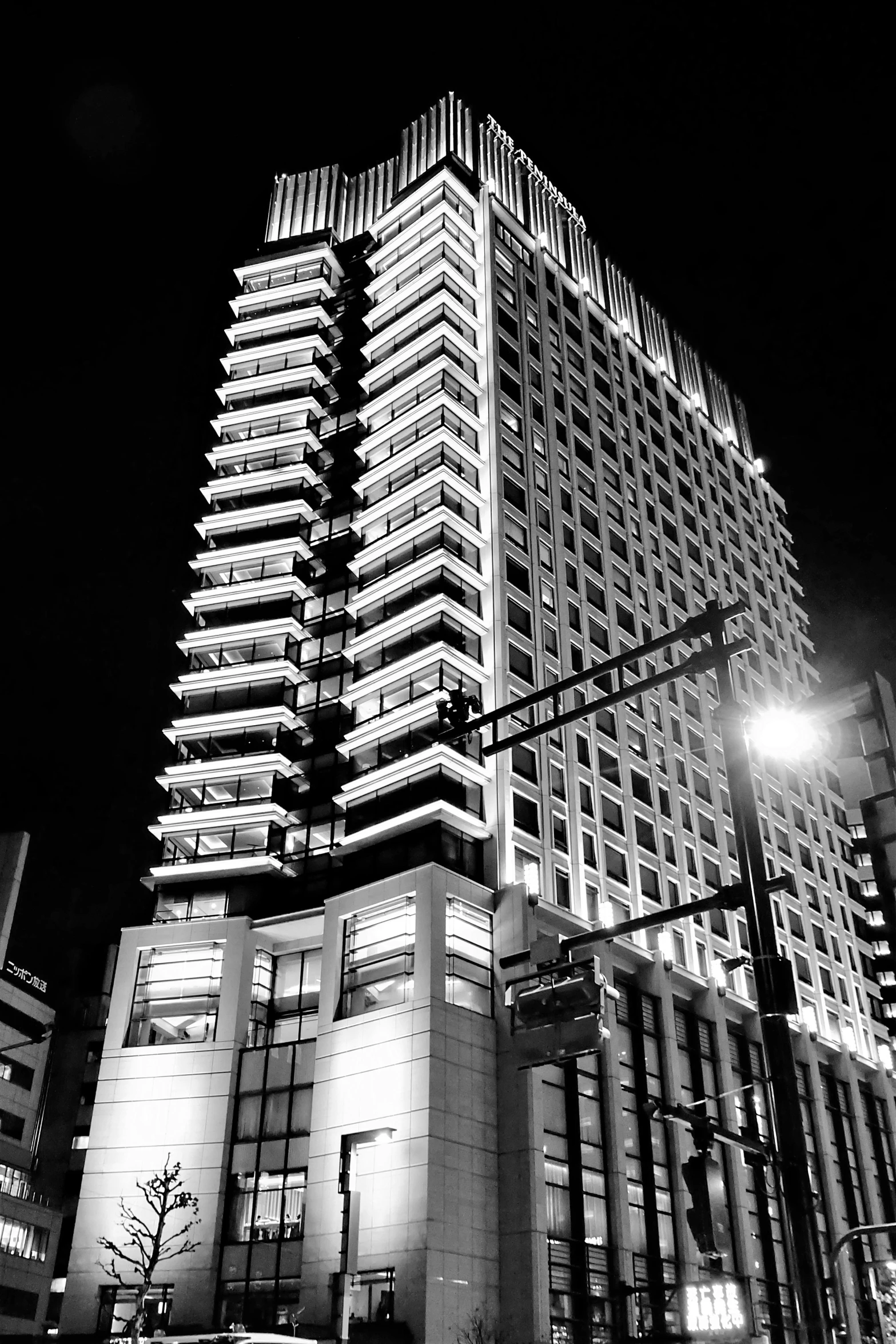 black and white po of a skyscr at night