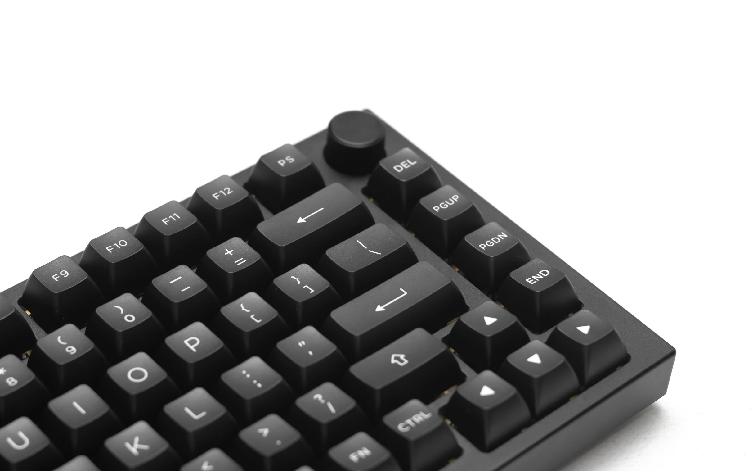 a keyboard with three different color keys sitting on top of the table