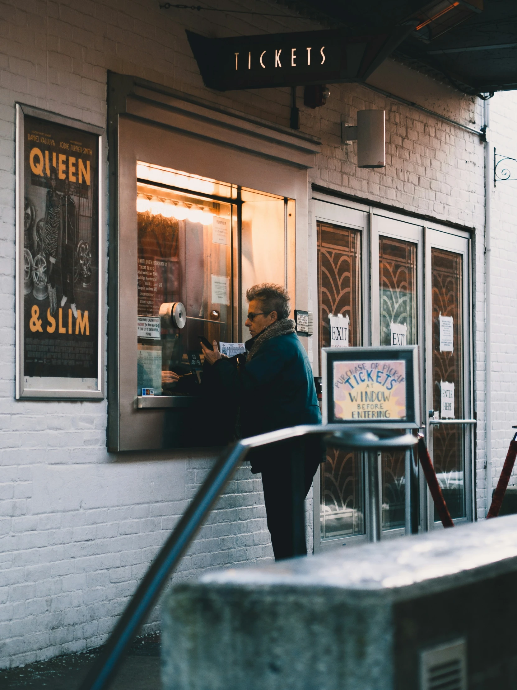 the entrance to an asian restaurant with a man ordering