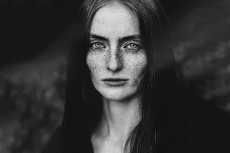 a portrait s of a woman with freckled hair