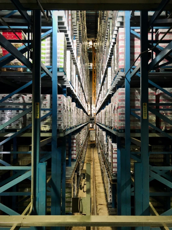 an industrial warehouse with shelving and lots of shelves