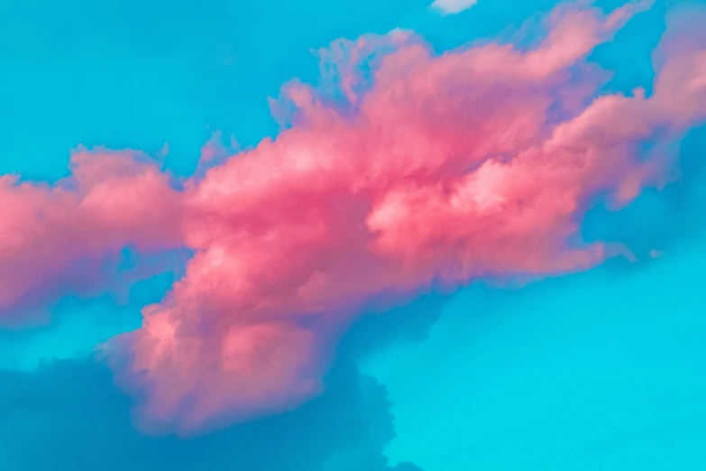 pink clouds are pictured against a blue sky