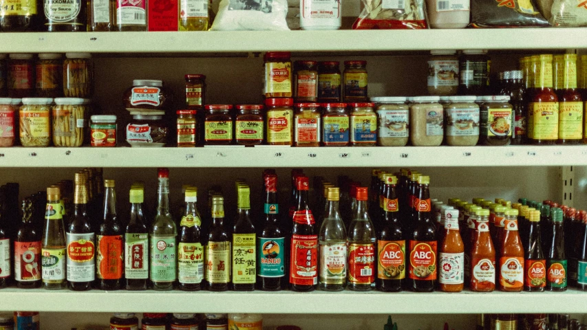 various types of condiments in a display case