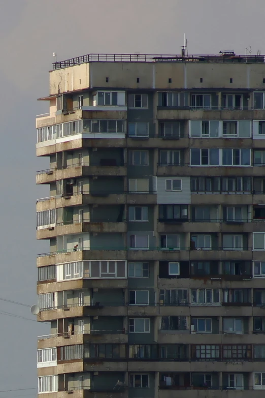 a building that has windows and balconies in front