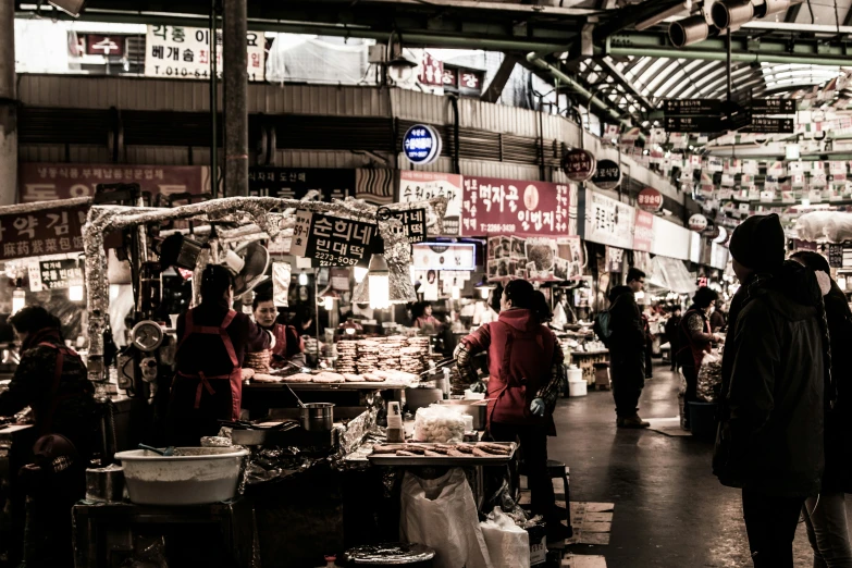 people stand at an asian market with a black and white po