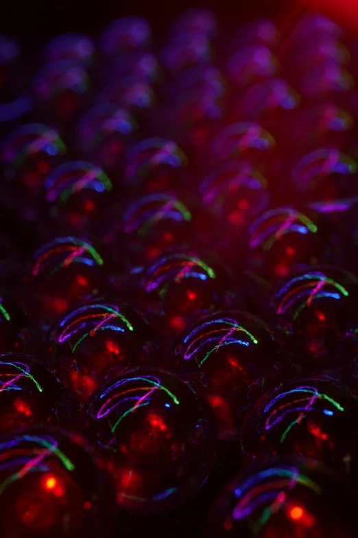 many shiny beads are shown brightly lit up