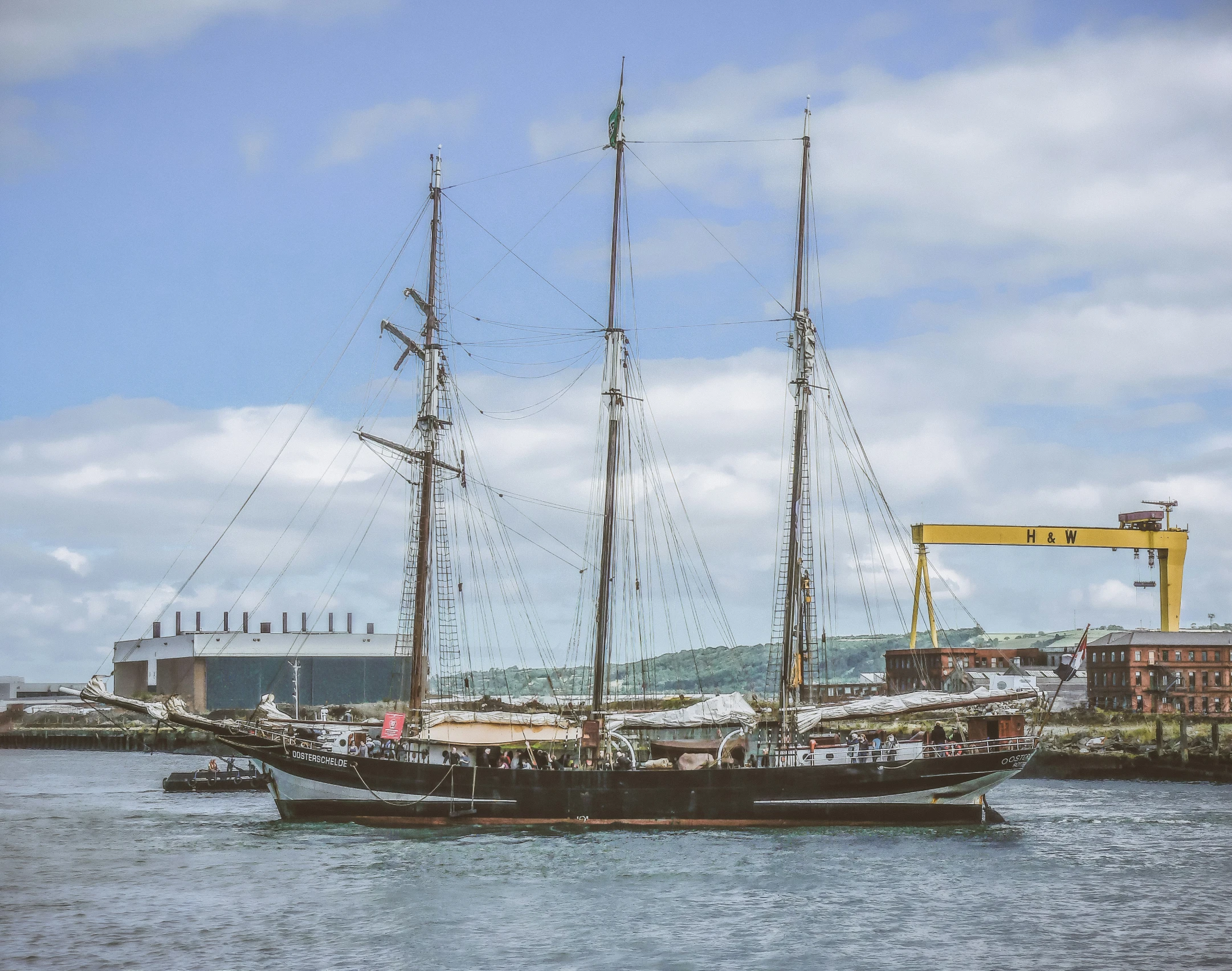 a large sailing ship with sails is in the water