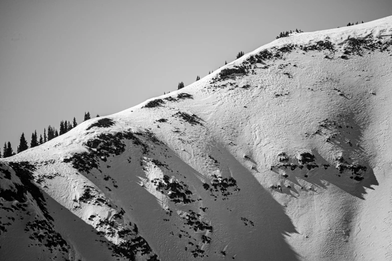 an image of a mountain top with snow on it