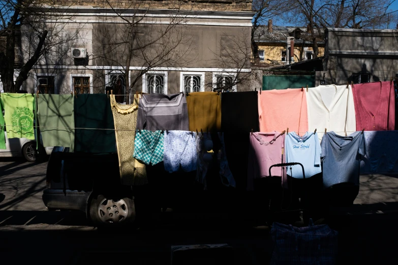 a line of clothes hanging out in front of buildings