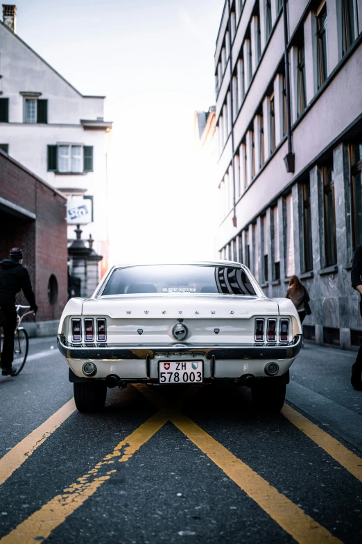 an old car parked on the side of the road