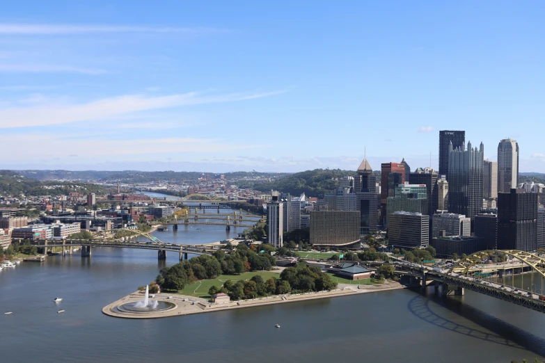 an aerial view of some city with river flowing through the center