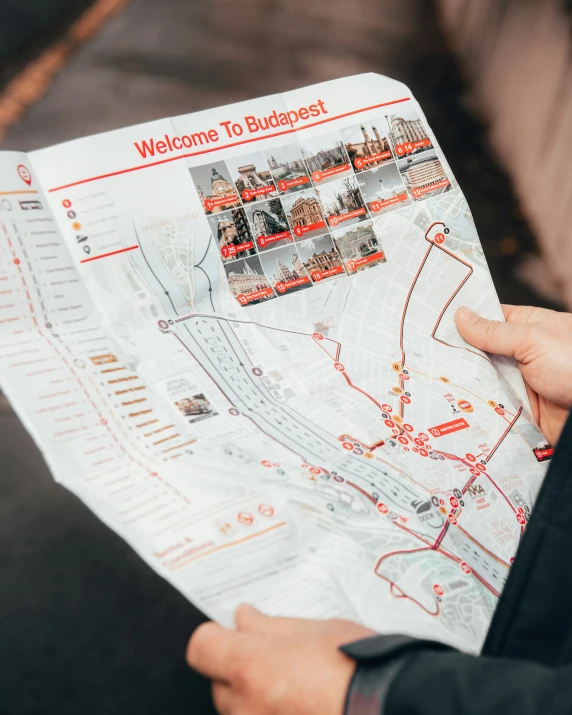 man looking at map with large red arrows