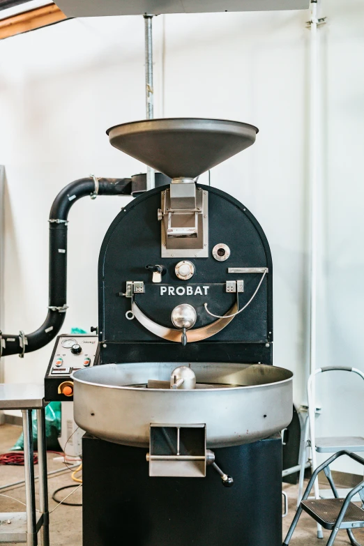 a black and silver machine inside of a room