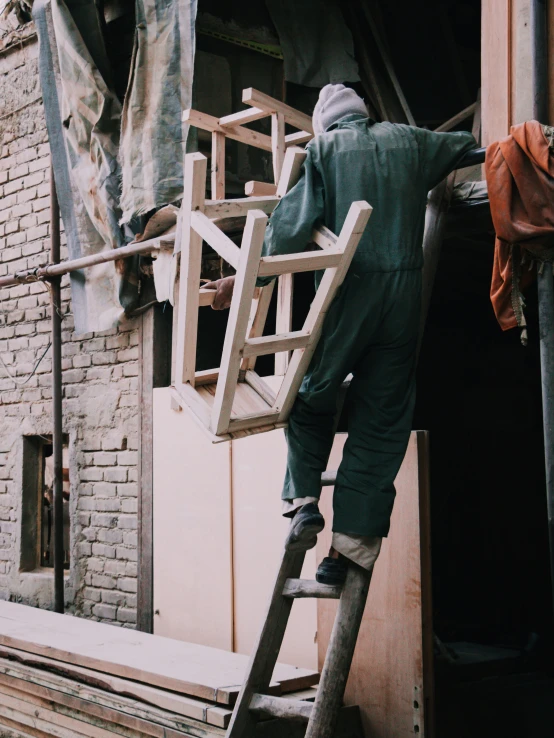 two men working on the outside of an apartment building