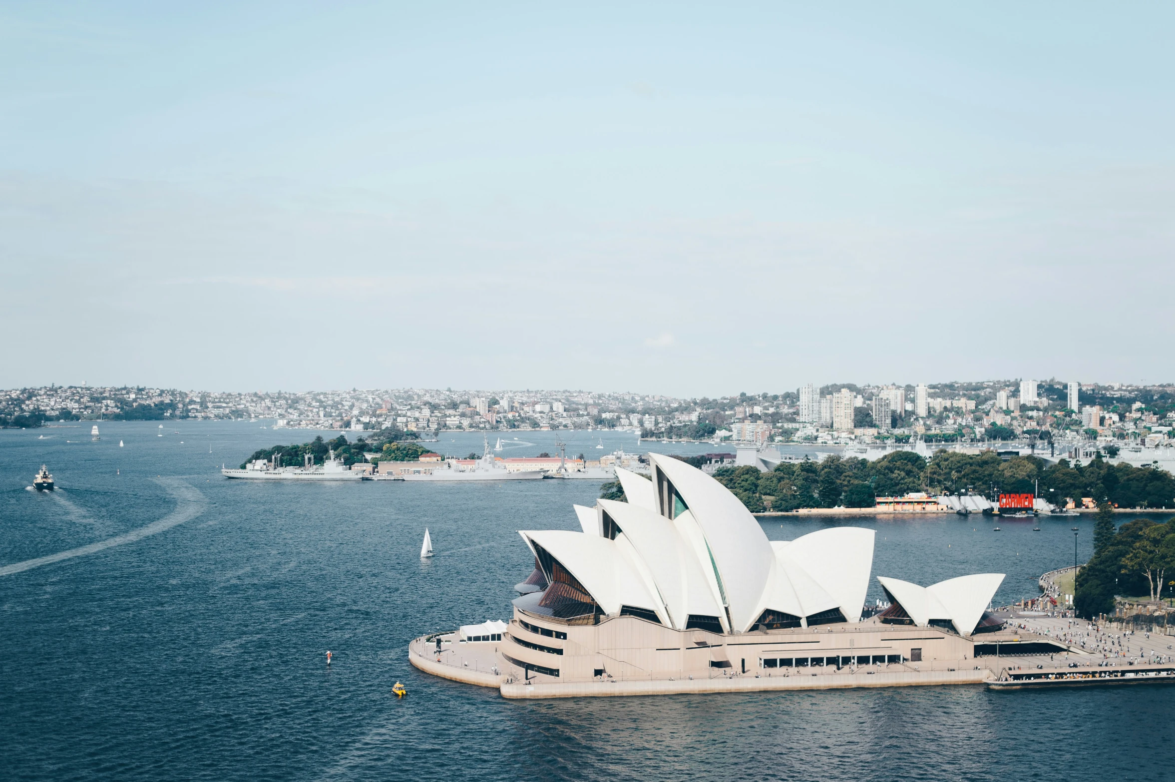 a view of a boat and harbor in sydney with opera house