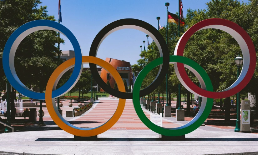 a statue with a huge colored ring in it