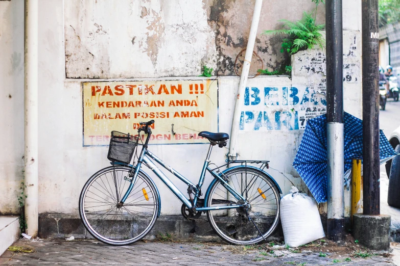 there is a bike parked against the wall