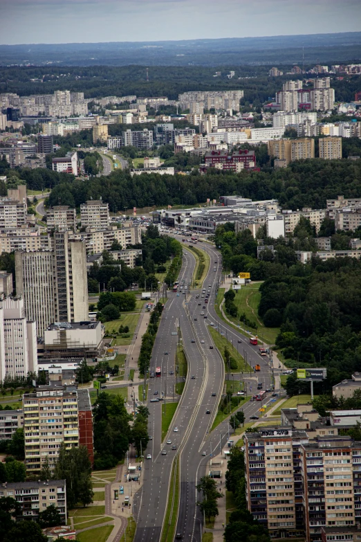 a picture of a highway surrounded by tall buildings