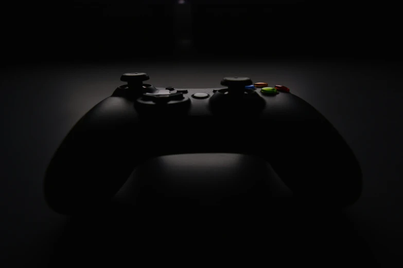 an illuminated video game controller lit by the back light