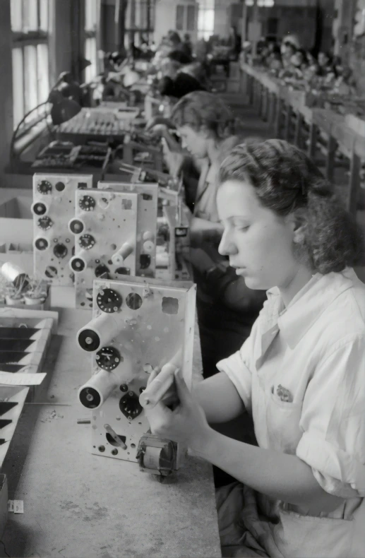 the women are working in the assembly line