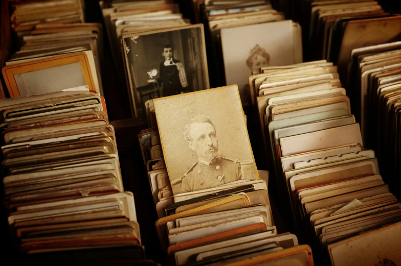 a picture of a man in the middle of stacks of records