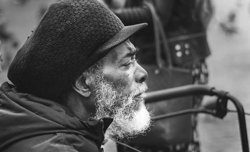 a black and white po of an older man with white beard